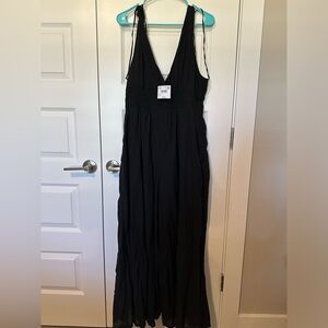 Sleeveless, 100% cotton smocked jumpsuit.